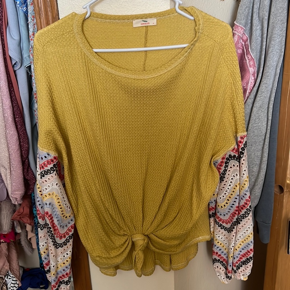 Waffle knit top with printed sleeves; size medium; perfect condition